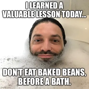 Louie in a bubble bath. Title reads: 'I learned a valuable lesson today. Don’t eat baked beans before a bath'
